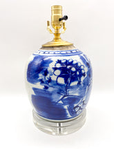 Load image into Gallery viewer, Blue and white antique Chinese floral-patterned ceramic ginger jar lamp with brass hardware on stacked acrylic base
