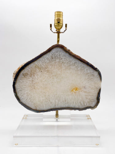 A Brazilian Agate slice mounted on a acrylic stand as a lamp.