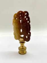 Load image into Gallery viewer, carved amber lamp finial, openwork carved finial detail, vintage style carved lamp finial with cutouts, amber tone decorative finial with brass base, intricate carved finial for table lamp, detailed open cut lamp finial design, warm brown carved finial topper, ornamental pierced finial for lighting decor, unique vintage inspired lamp finial, sculptural carved finial with openwork pattern