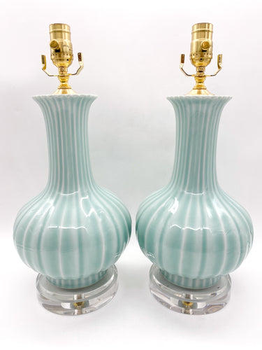 Pair of celadon minty green ceramic table lamps with gold accents on clear acrylic graduated bases 24