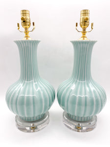 Pair of celadon minty green ceramic table lamps with gold accents on clear acrylic graduated bases 24" height