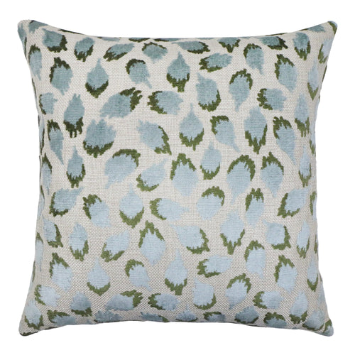 Decorative pillow with blue and green leaf pattern on a white background