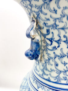 large blue and white chinese ceramic bell jar top urn with fou lion handles greek key and other hand painted design elements and patterns
