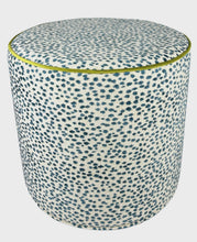 Load image into Gallery viewer, blue speckled abstract pattern on white linen like slip cover cylindrical ottoman with lime green piping