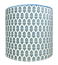 Load image into Gallery viewer, French blue botanical pattern on white background removable slipcover ottoman with light french blue velvety piping cylindrical ottoman