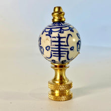 Load image into Gallery viewer, blue and white floral porcelain lamp finial, brass lamp finial with ceramic ball top, chinoiserie style lamp finial with hand painted flower design, decorative blue white finial for table or floor lamps, classic porcelain and brass lamp finial with floral pattern, traditional lamp finial with blue floral motif and gold base, ceramic ball finial with blue flower detail and brass hardware, elegant blue and white lamp finial fits standard lamp harp