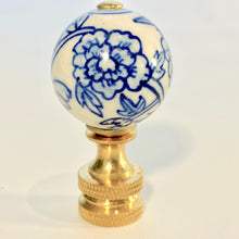 Load image into Gallery viewer, blue and white floral porcelain lamp finial, brass lamp finial with ceramic ball top, chinoiserie style lamp finial with hand painted flower design, decorative blue white finial for table or floor lamps, classic porcelain and brass lamp finial with floral pattern, traditional lamp finial with blue floral motif and gold base, ceramic ball finial with blue flower detail and brass hardware, elegant blue and white lamp finial fits standard lamp harp